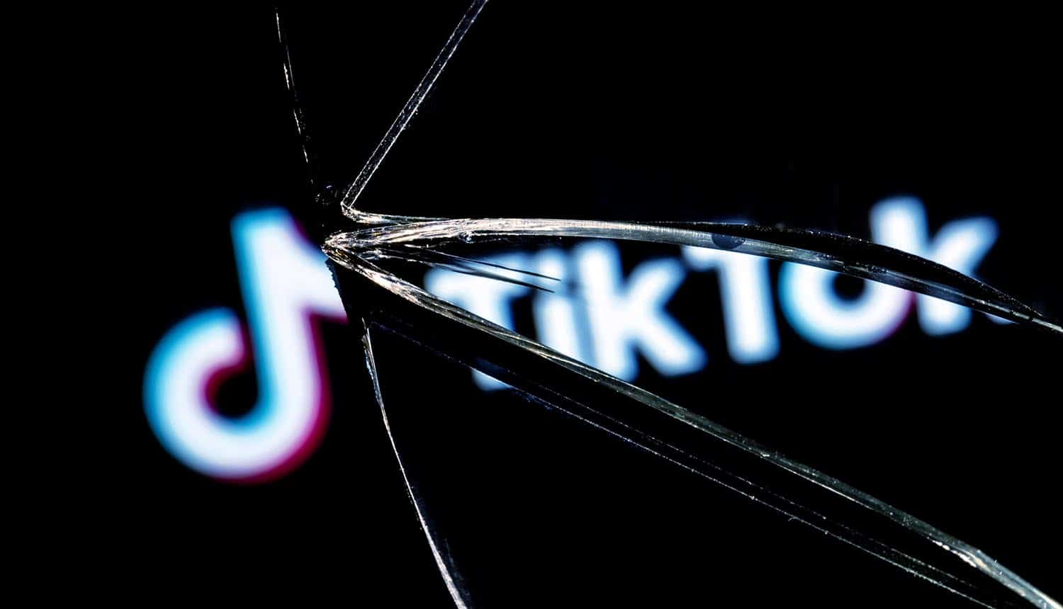 TikTok social network in the reflection of a broken mirror TikTok hack with account takeover flaw