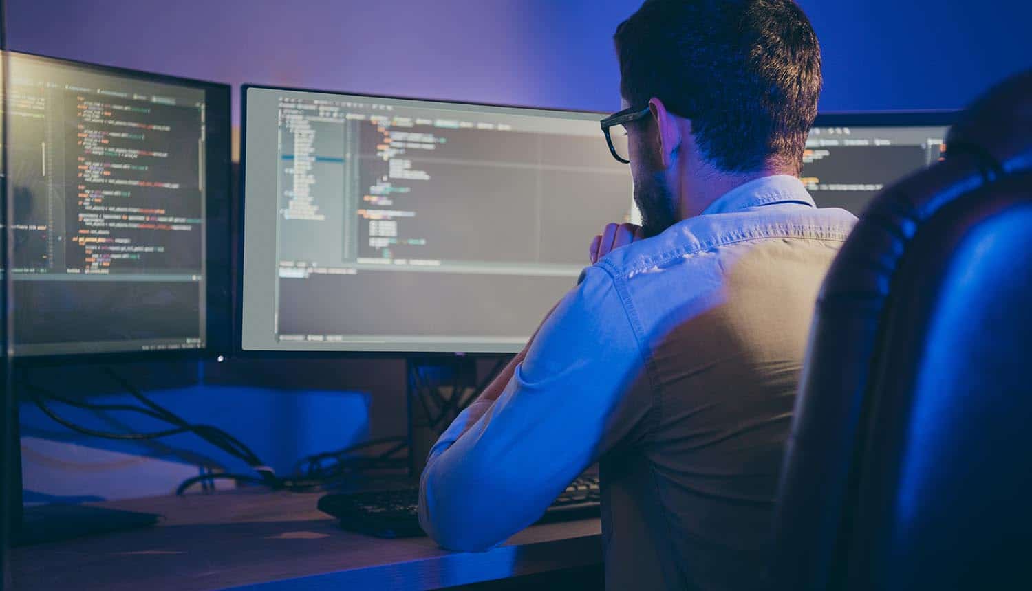 Back view of developer working showing vulnerability management and DevSecOps