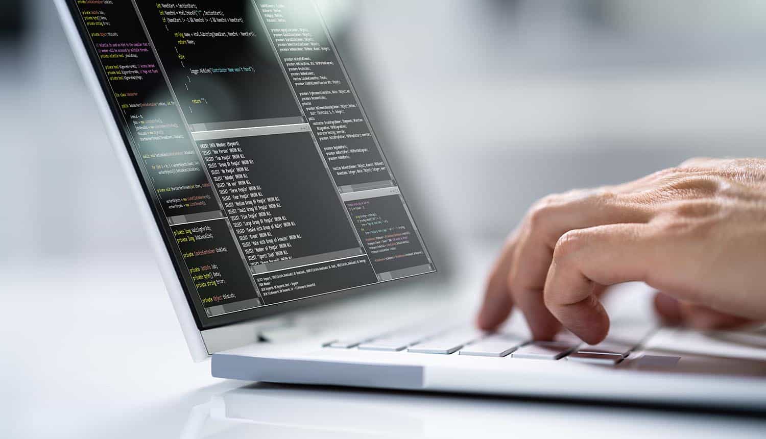 Computer programmer using laptop showing open source software security
