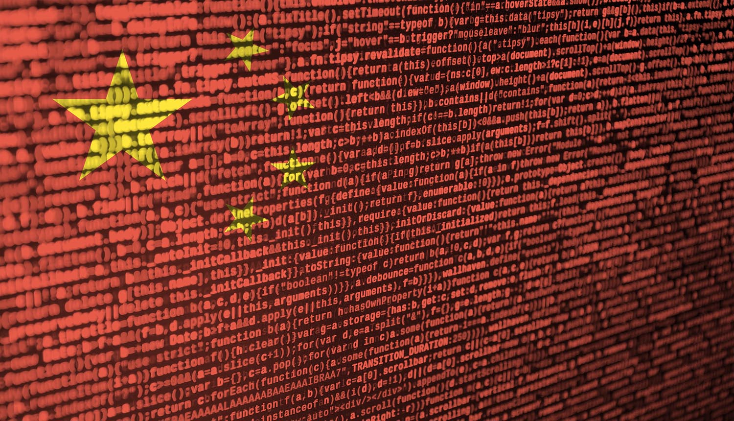 China flag on the screen with program code showing Chinese hackers theft of Covid benefits