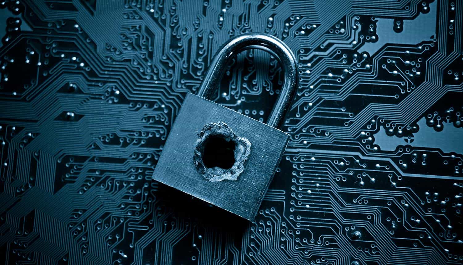 Security lock with a hole on computer circuit board showing Log4Shell vulnerability