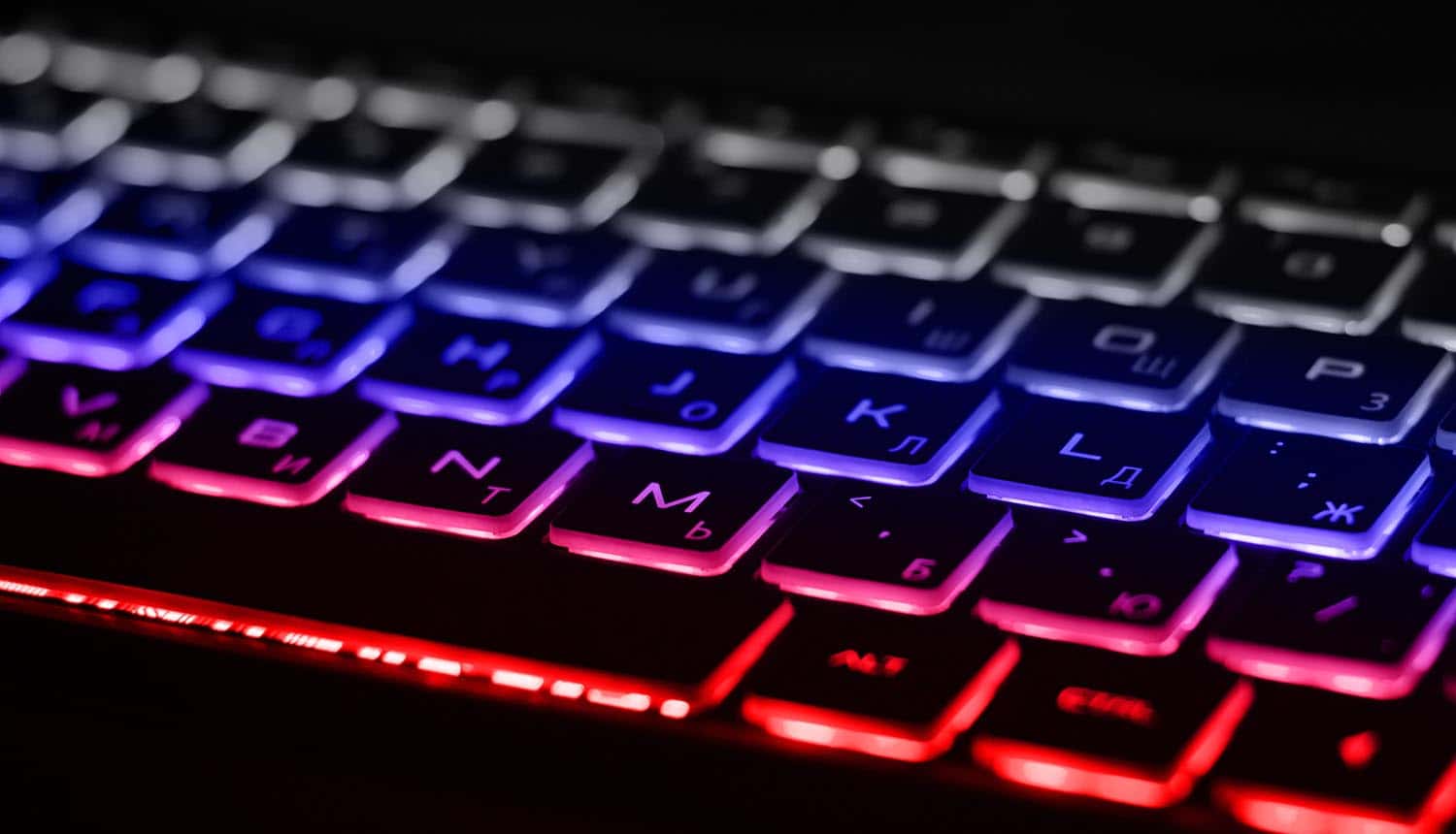Keyboard with white, blue and red backlight showing Ukraine views Russian cyber attacks as war crimes