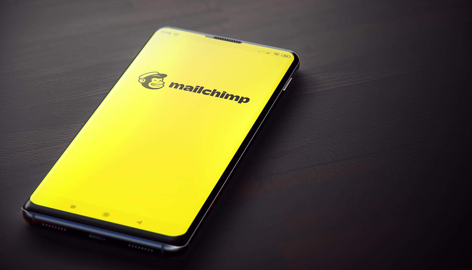 Mailchimp application on smartphone screen showing security breach via customer support tools