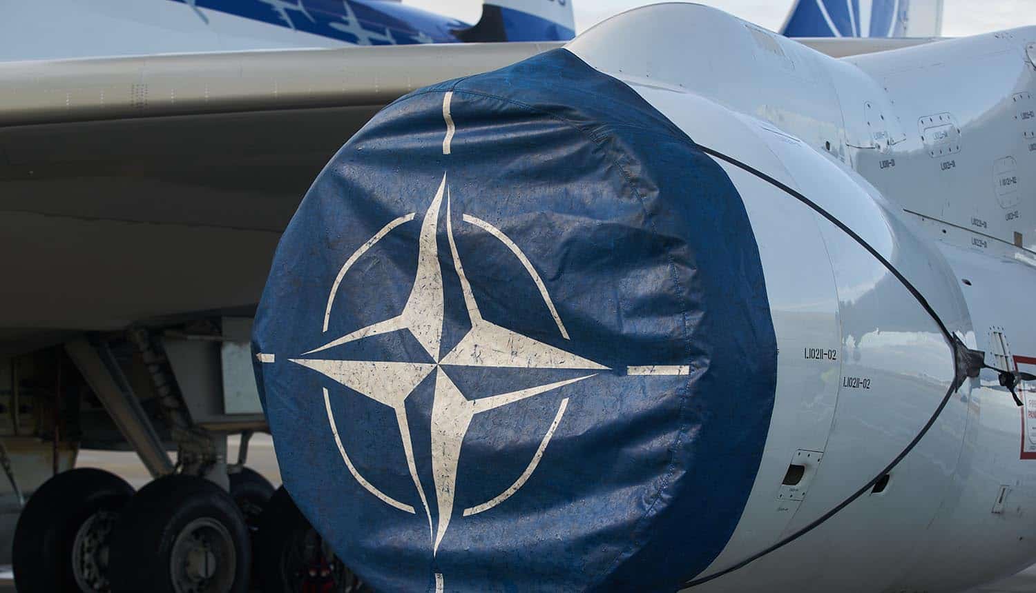 NATO plane on runway showing Russian hackers DDoS attacks disrupt earthquake relief