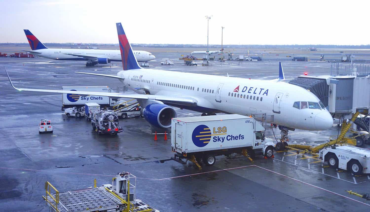 Aircraft at the gate at airport showing cybersecurity requirements for aviation sector by TSA