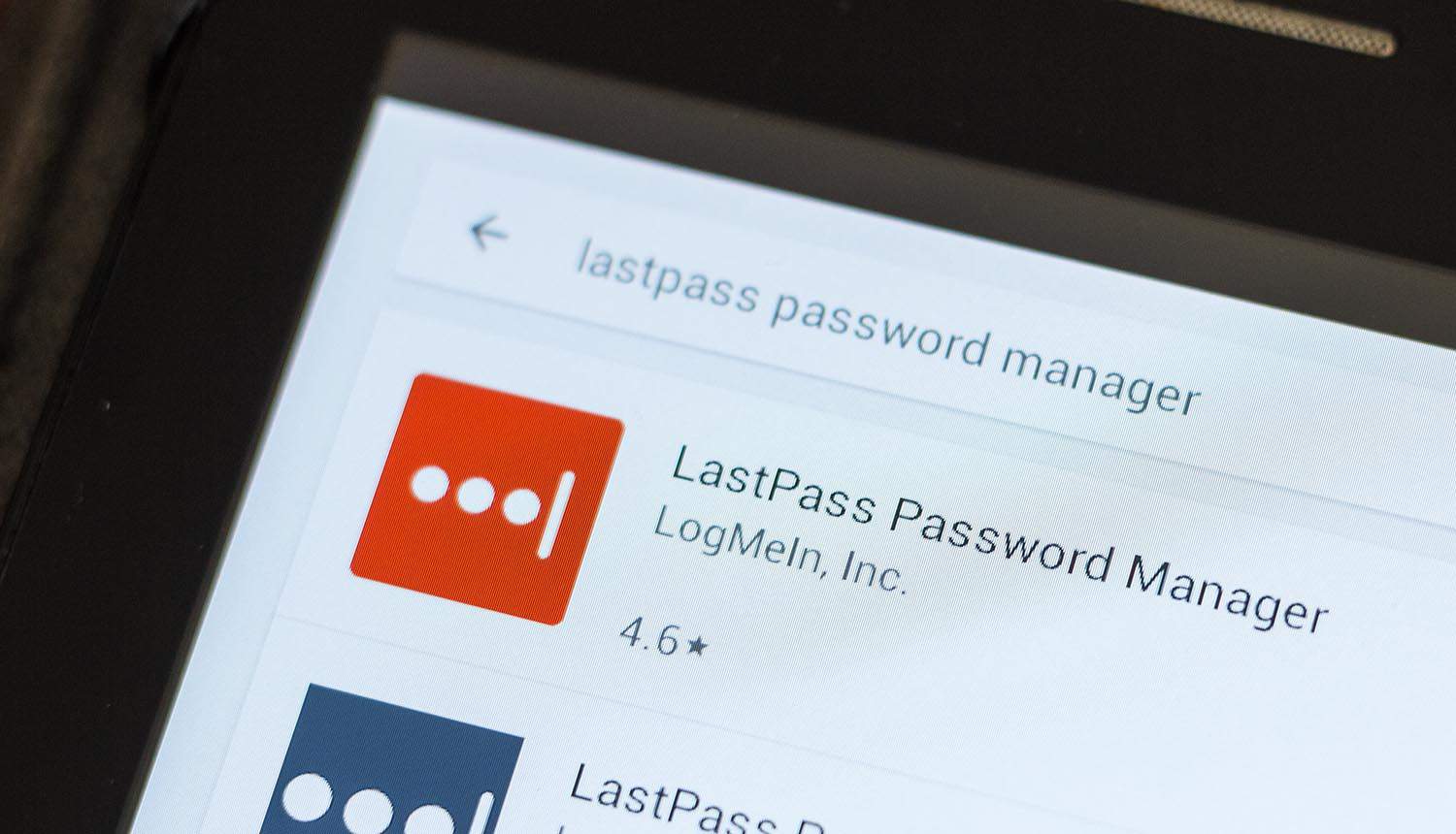 LastPass Password Manager mobile app on the display of tablet showing DevOps Engineer link to hacked password vaults