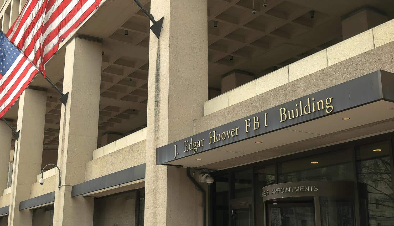 Entrance to the FBI building showing cyber crime report