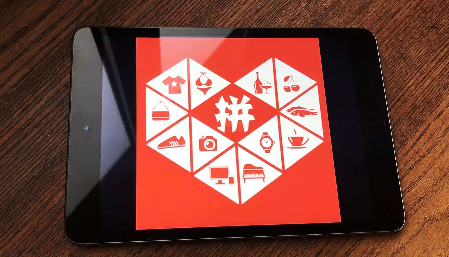 Pinduoduo logo on tablet screen showing malware in Chinese shopping app