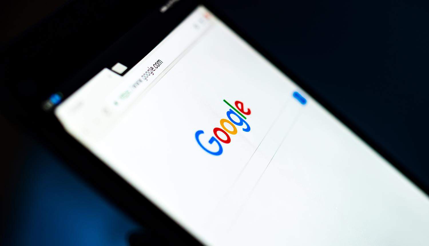 Close up tablet with Google on the screen showing cyber risk of top-level domains
