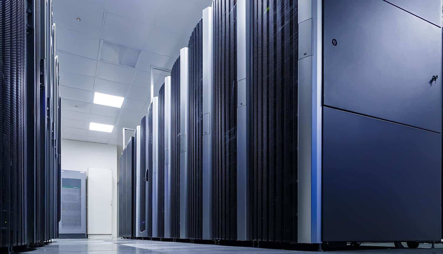 Server room with computers showing ransomware attack on Danish hosting providers