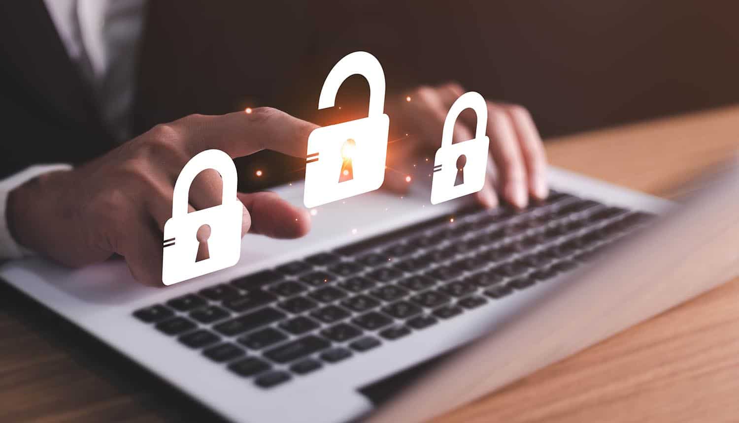 Lock icons on laptop showing Iranian hackers target defense organizations with password spray attacks