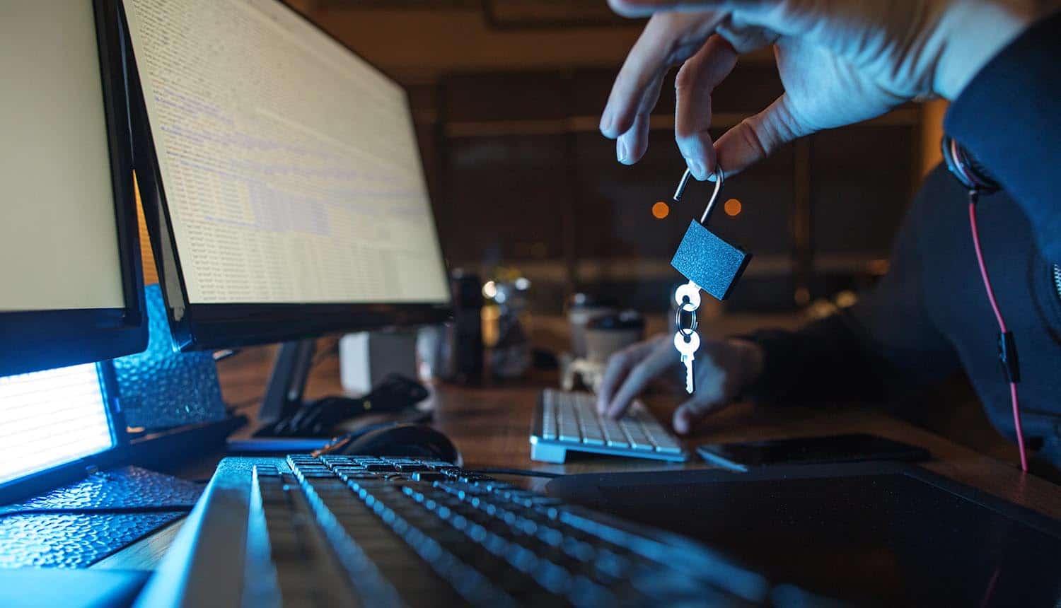 Hand holding lock showing security breach of Okta support system