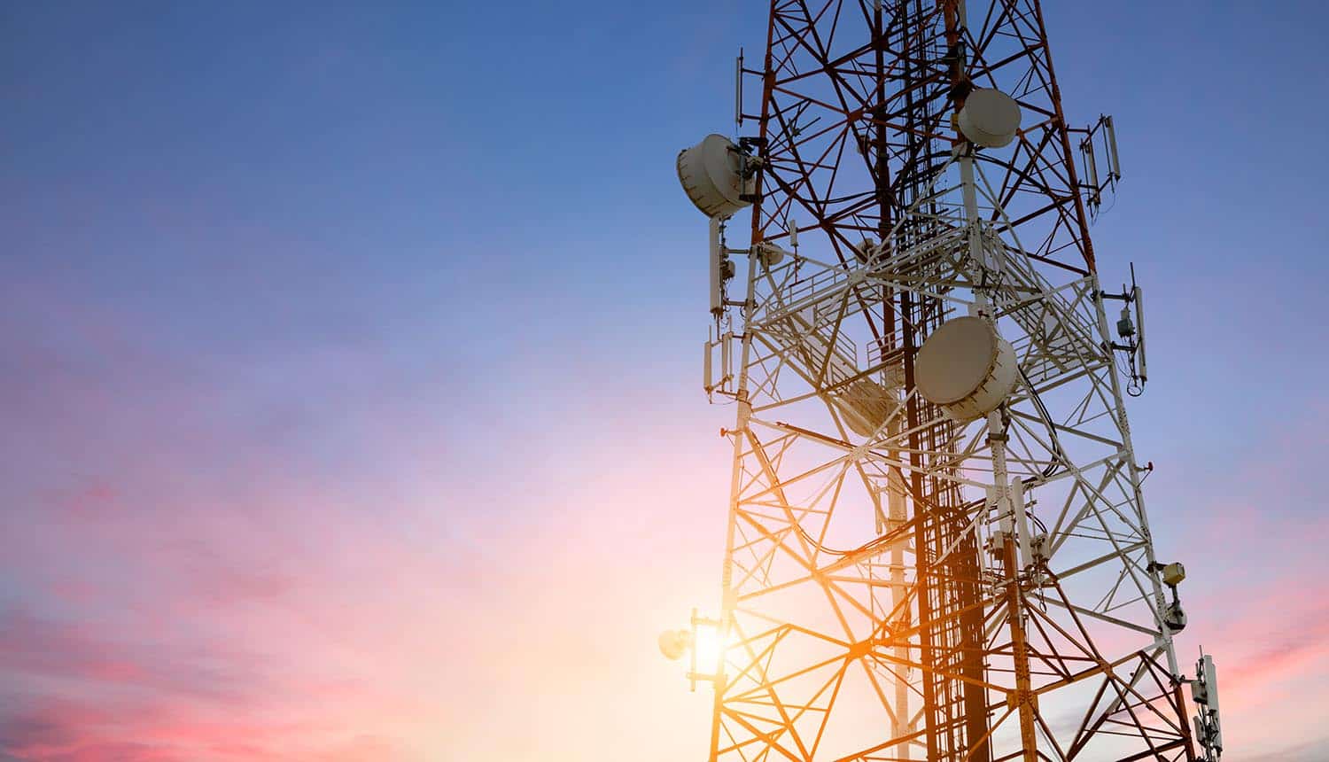 Telecom network tower at sunset showing Russian hackers access to Kyivstar telecoms provider