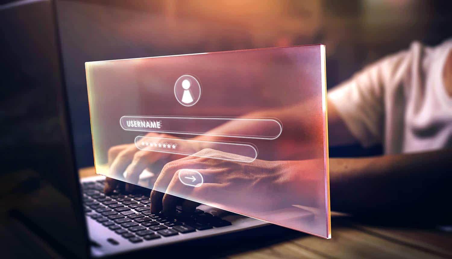 User typing on login screen showing 23andMe data breach blamed on password reuse
