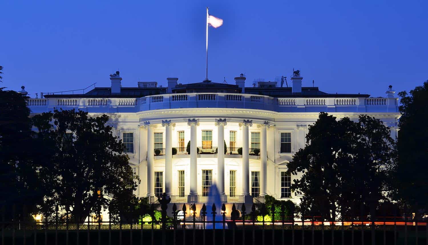 The White House at night showing cybersecurity budget