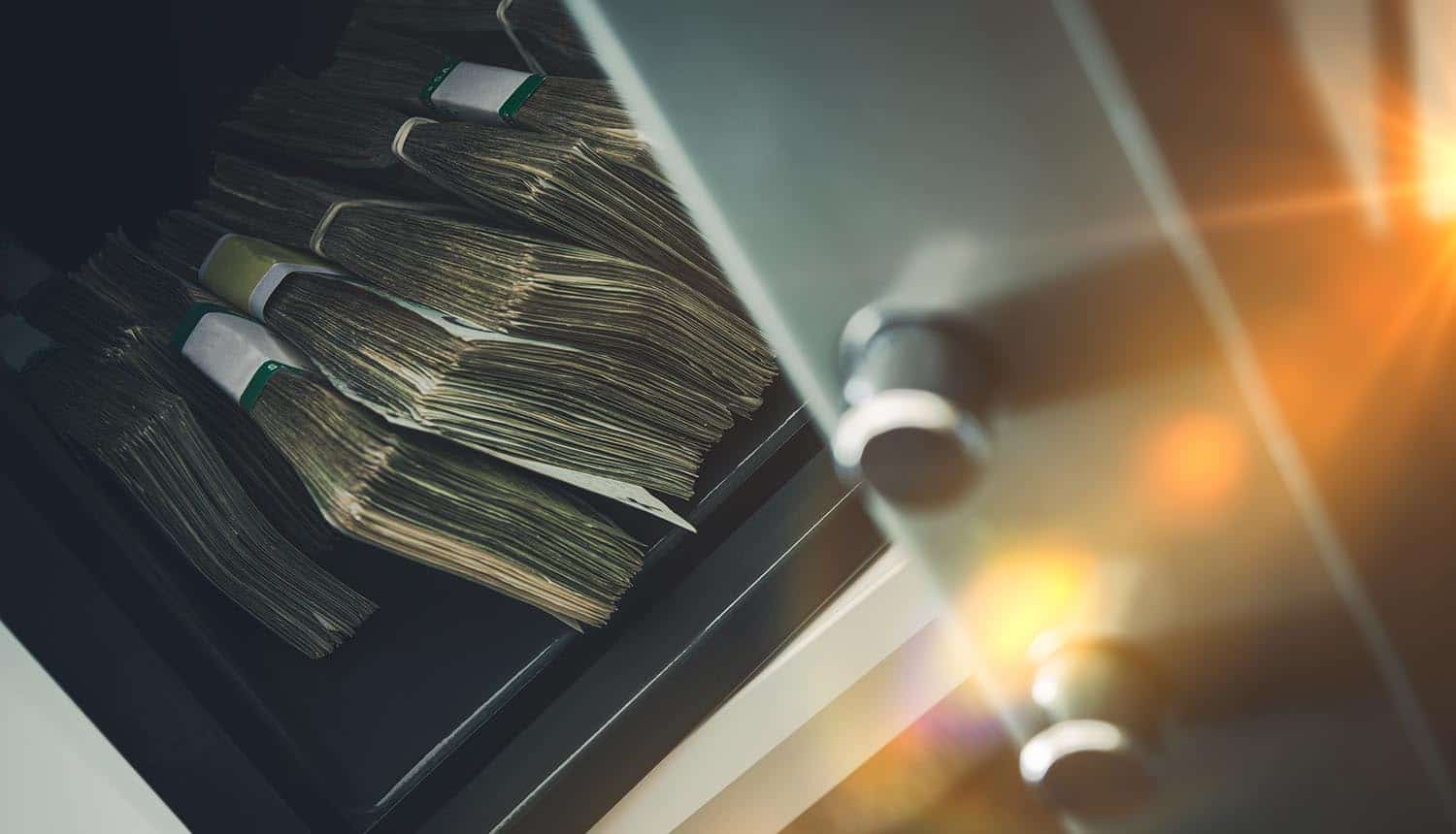 Vault with pile of cash showing ransomware gang exit scam