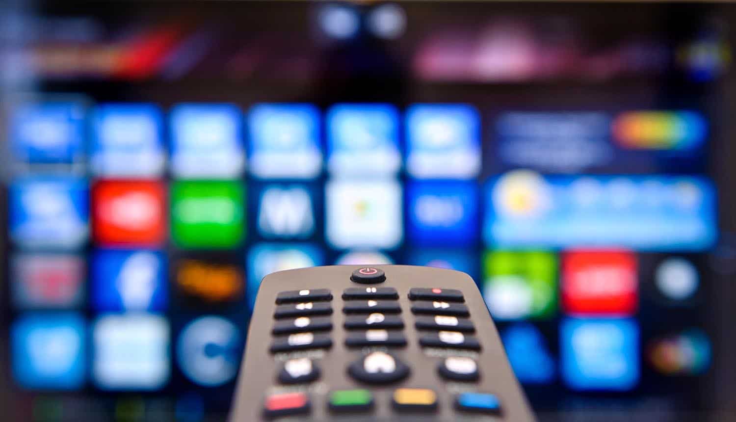 TV remote and smart TV showing Roku 2FA after credential stuffing attacks