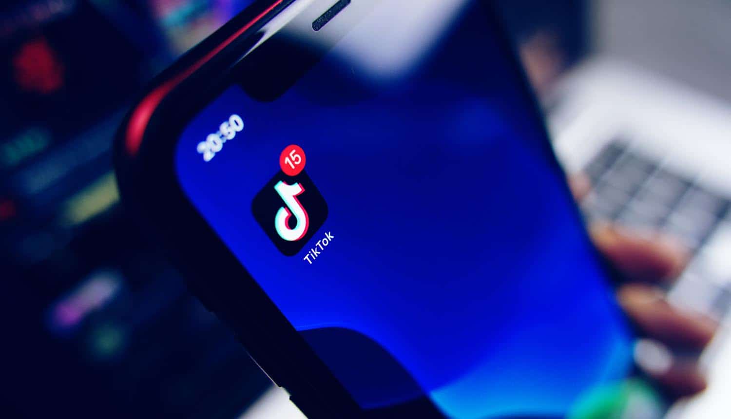TikTok app icon on screen showing TikTok ban due to national security