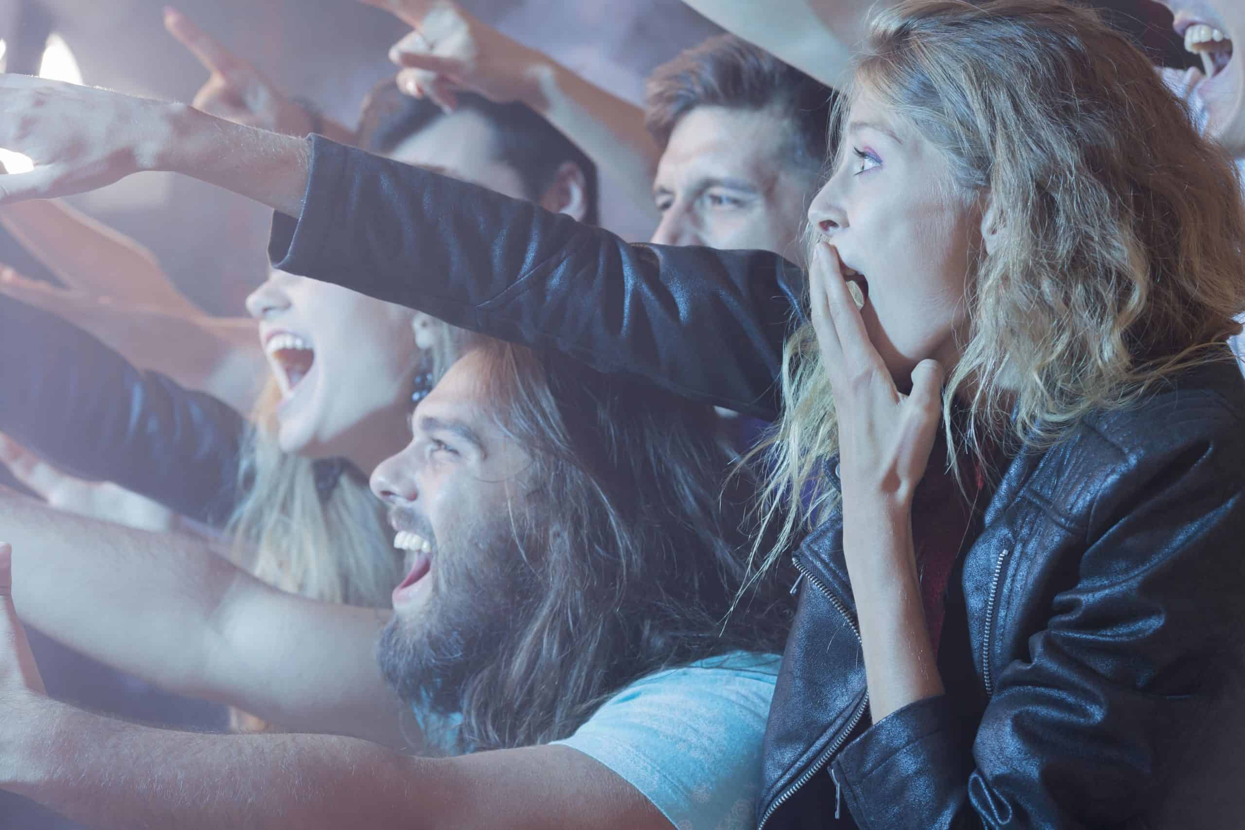 Crowd of excited people showing Ticketmaster hack leaked concert tickets