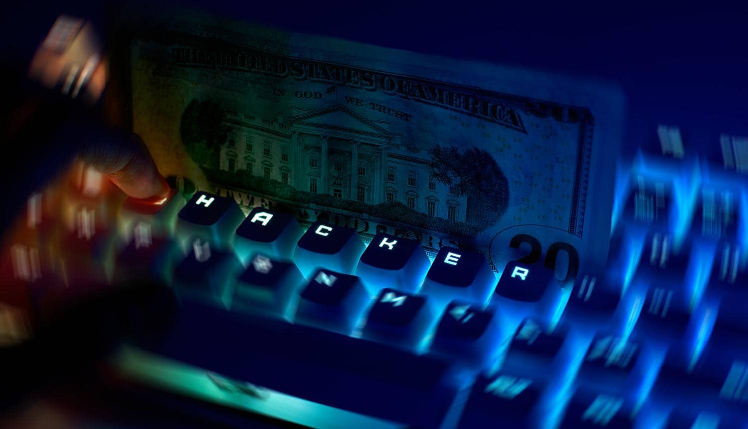 Keyboard with dollar notes showing cyber attack on money transfer service