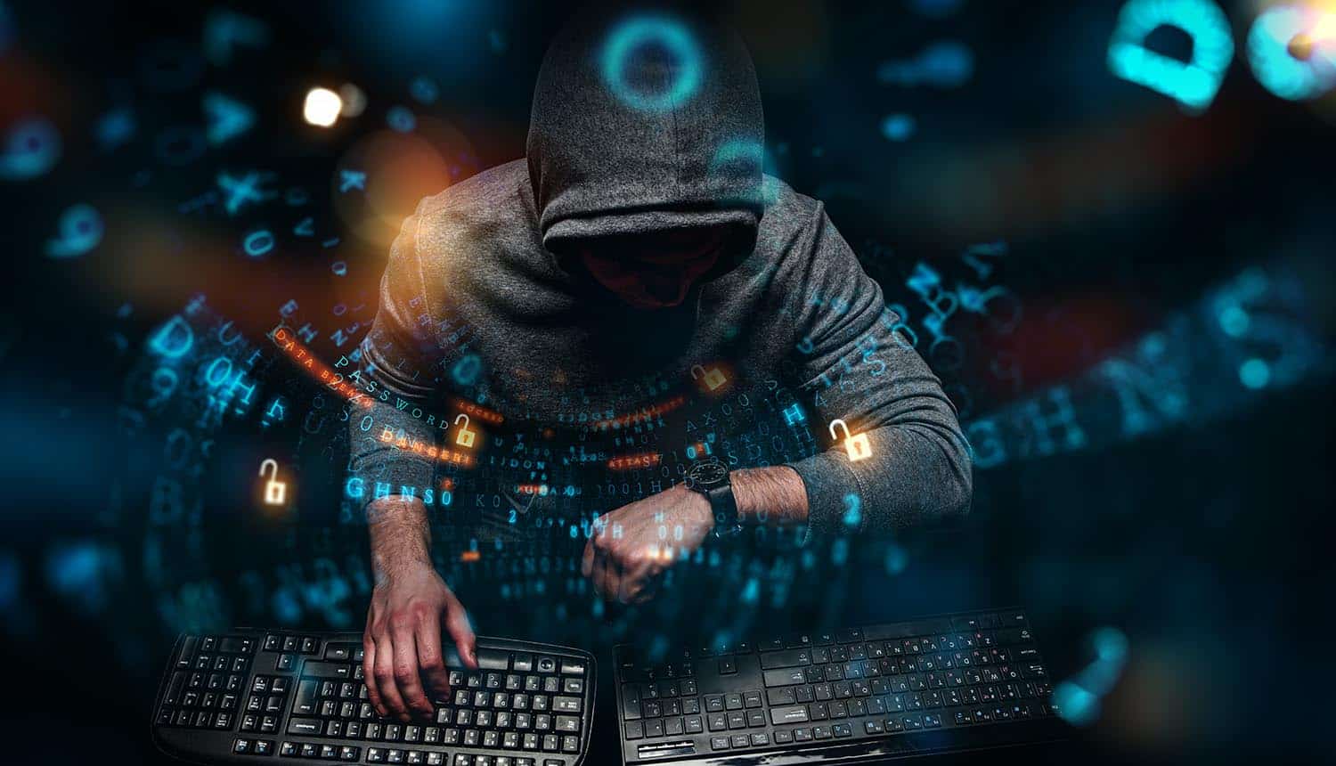 Hacker working on machine showing malware attacks on air-gapped systems