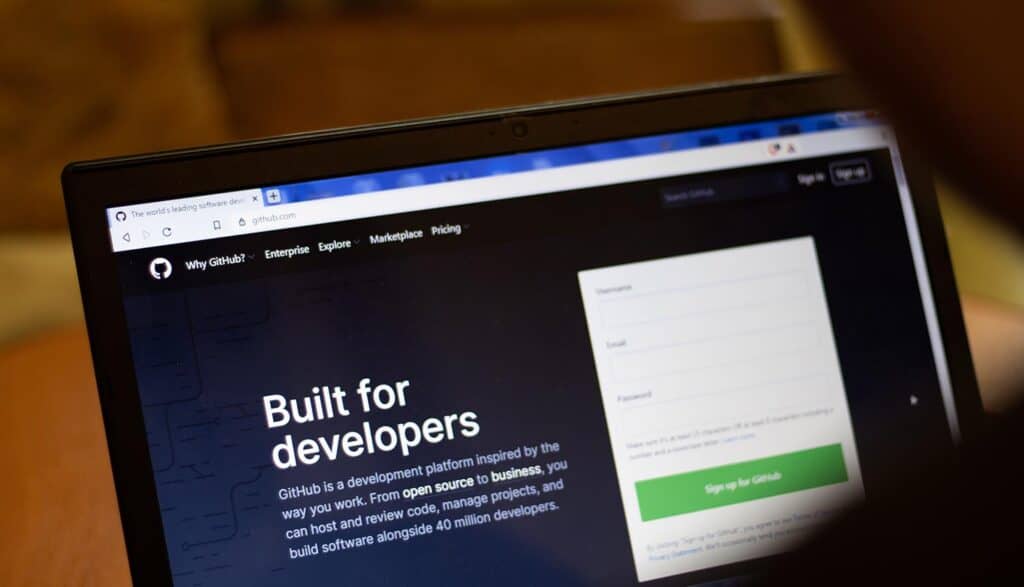GitHub website on laptop screen showing security breach of repositories