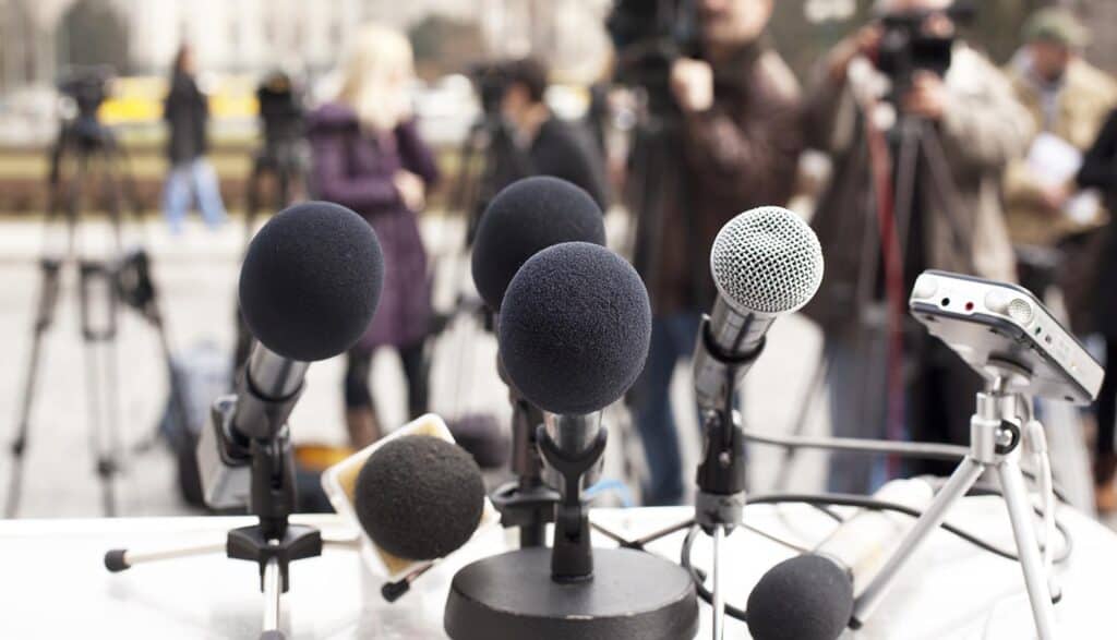 Microphones during news conference showing fake data breach reports