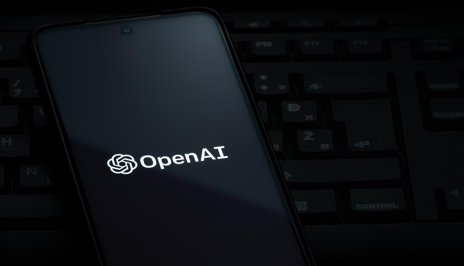 OpenAI logo on screen showing insider threats