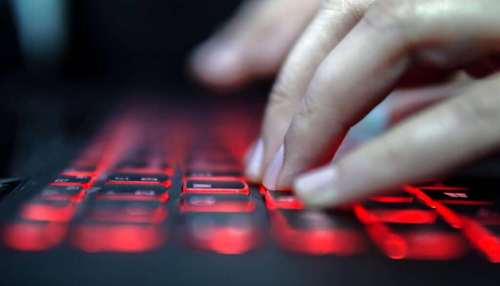 Hands on keyboard showing PHP vulnerabilities